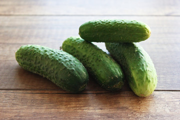 Cucumber on wooden background, vegetables