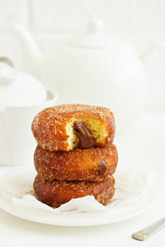 Donuts with cinnamon and chocolate cream. Homemade baking. Selective focus.