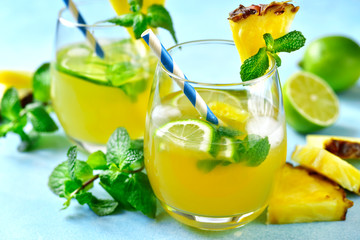 Homemade summer lemonade with pineapple, orange and lime.