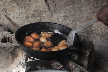 fresh donuts in big bowl: cooking in Africa close up