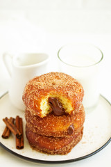 Donuts with cinnamon and chocolate cream. Homemade baking. Selective focus.