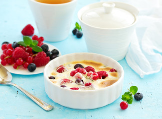 Zabaglione with champagne and berries. French dessert.