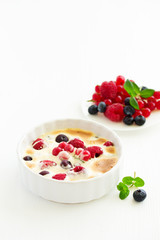 Zabaglione with champagne and berries. French dessert.