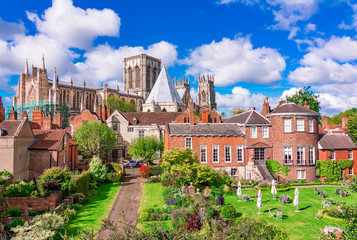 York, England, United Kingdom: York Minster, cathedral of York, England, one of the largest of its kind in Northern Europe seen from the city walls - obrazy, fototapety, plakaty