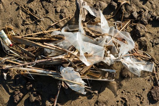 Plastic and litter material on sand beach