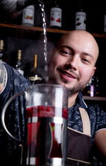 Process brewing tea,tea ceremony. Bartender pours hot water into the kettle to brew berry tea