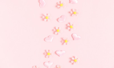 Valentine's Day background. Floral decor and pink hearts on light pink pastel background. Valentines day concept, design. Flat lay, top view, copy space 