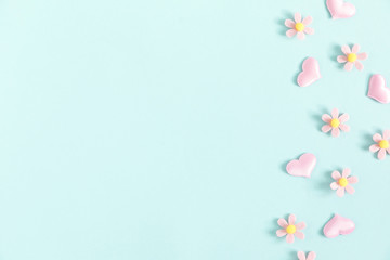 Valentine's Day background. Floral decor and pink hearts on pastel blue background. Valentines day concept, design. Flat lay, top view, copy space - Image