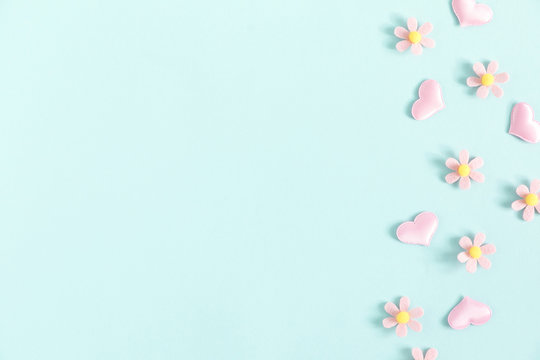 Valentine's Day background. Floral decor and pink hearts on pastel blue background. Valentines day concept, design. Flat lay, top view, copy space - Image