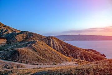 Awesome view to the sea from the top of hill with sunset