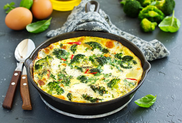 Frittata with vegetables and broccoli. View from above. Selective focus.