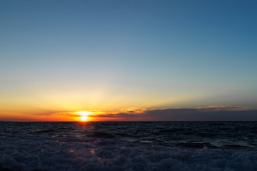 Fototapeta na wymiar Sunset on the sea. Beautiful landscape. Reflection of light in water.