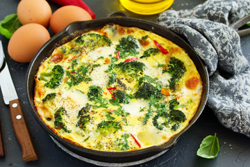 Frittata with vegetables and broccoli. View from above. Selective focus.