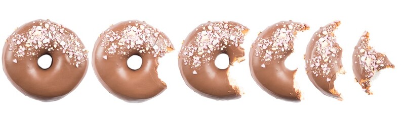 Chocolate glazed doghnut with sprinkled sweets on top on white background. High resolution image for food industry.