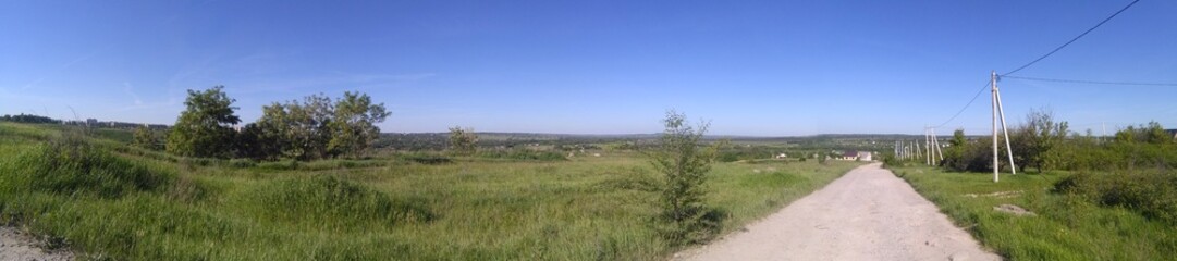 rural landscape with fence and blue sky