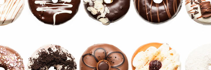 Multiple doughnuts on white background. High resolution image for food industry.