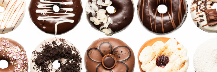Multiple doughnuts on white background. High resolution image for food industry.