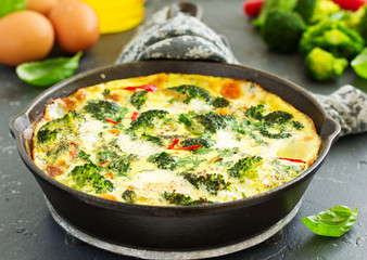 Frittata with vegetables and broccoli. View from above. Selective focus.
