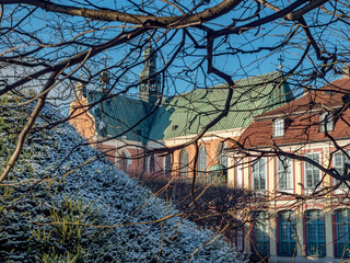 Abbots Palace built in the rococo style and located in Oliwa park with cathedral church in the back. Winter scenery. Gdansk, Poland © Jarek Fethke