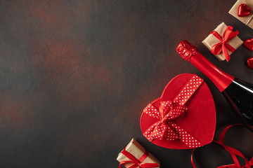 Valentine's Day with a box of chocolates in the form of heart gifts and champagne. Top view with...