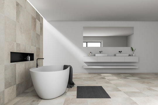 Side view of beige bathroom, tub and sink