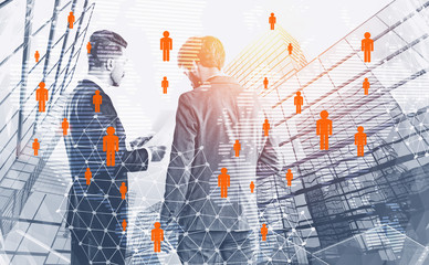 Two businessmen talking in city, people network