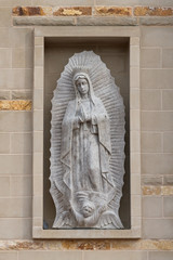Statue of Our Lady of Guadalupe  outside the Ave Maria Catholic Church in Ave Maria, Florida