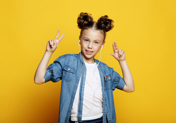 Little girl showing two hands with victory gesture