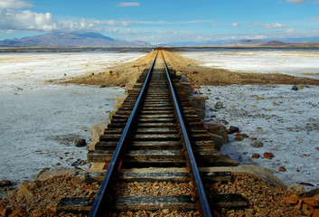 Fototapeta na wymiar Train tracks in the Salt Flats of Uyuni