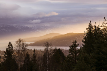 Sun Rays Over Mountain Valley at Sunset in Winter