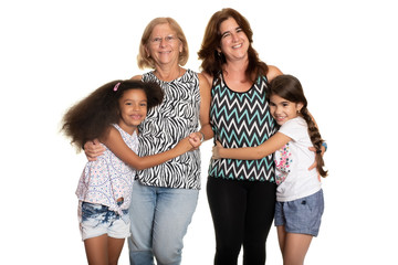 Multiracial family - Mom and grandmother hugging their mixed raced children