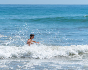 Boy playing surf.