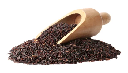 Foto op Canvas Scoop and uncooked black rice on white background © New Africa
