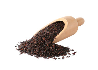 Scoop and uncooked black rice on white background