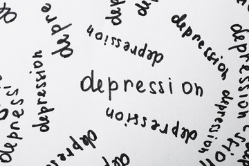 Many written words Depression on white paper as background, top view