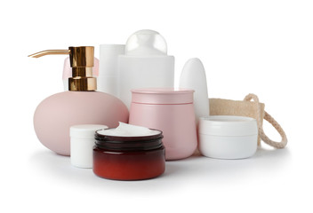 Different body care products and wisp on white background