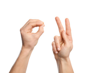 Man showing word okay on white background, closeup. Sign language