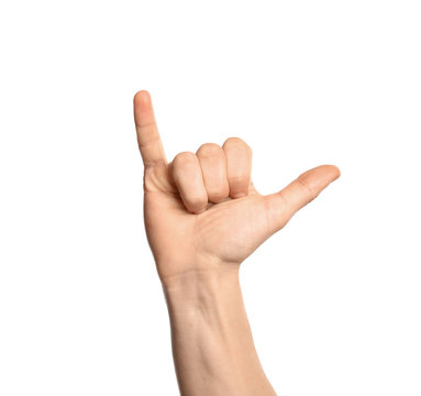 Man showing Y letter on white background, closeup. Sign language