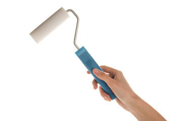 Woman holding paint roller brush on white background, closeup