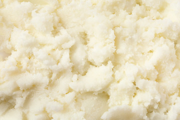 Fresh shea butter as background, top view. Cosmetic product