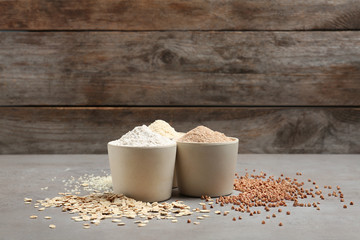 Composition with different types of flour on table. Space for text