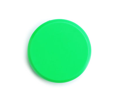 Bright green plastic magnet on white background, top view