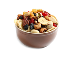 Bowl with different dried fruits and nuts on white background