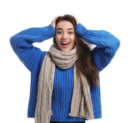 Young woman wearing warm clothes on white background. Winter season