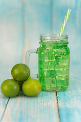 Lemonade summer cold drink with wooden background