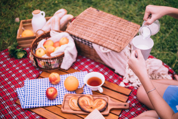 Close up of woman enjoying picnic in a park.