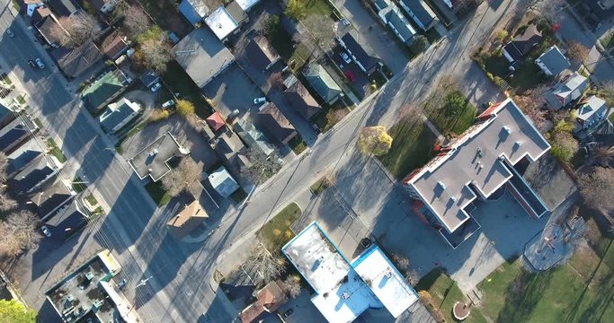 Red Brick Apartment Building And Neighborhood Top Down Aerial View Flyover 4K
