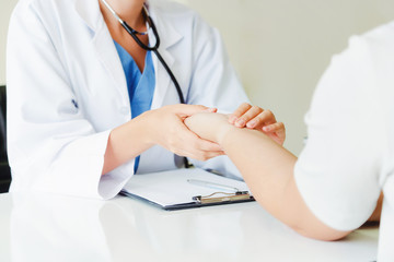 Female patient visits woman doctor or gynecologist during gynaecology check up in office at the...