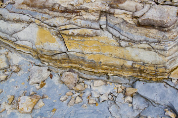 Blue and Yellow Layers of Stones and Rocks with Cracks