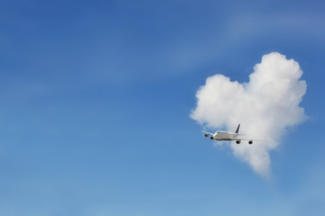 airplane and  heart cloud on sky